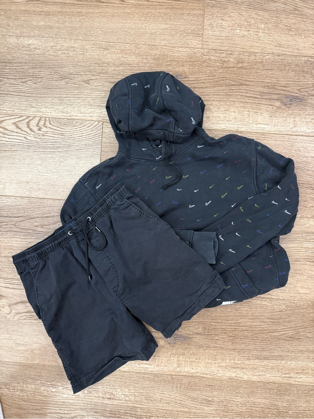 Nike Black Pullover Hoodie with Multicolor Mini Swoosh Pattern with Shorts.